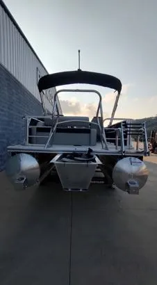 Slide: The Image of 2026 South Bay 224UL LE pontoon boat, rear view, docked outdoors. - 9