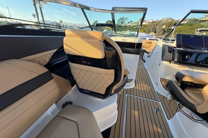 Slide: The Image of 2026 Sea Ray SLX 280 Outboard interior with luxurious seating and modern design. - 14