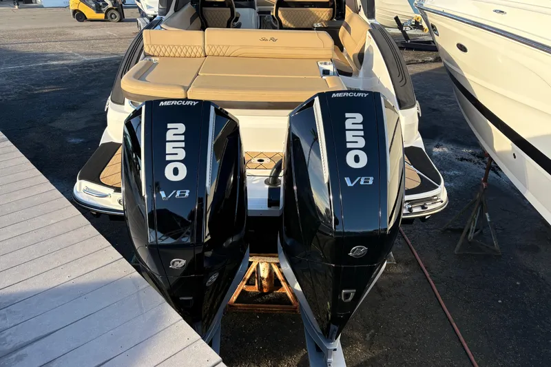 Slide: The Image of 2026 Sea Ray SLX 280 Outboard with twin Mercury 250 V8 engines, docked. - 2