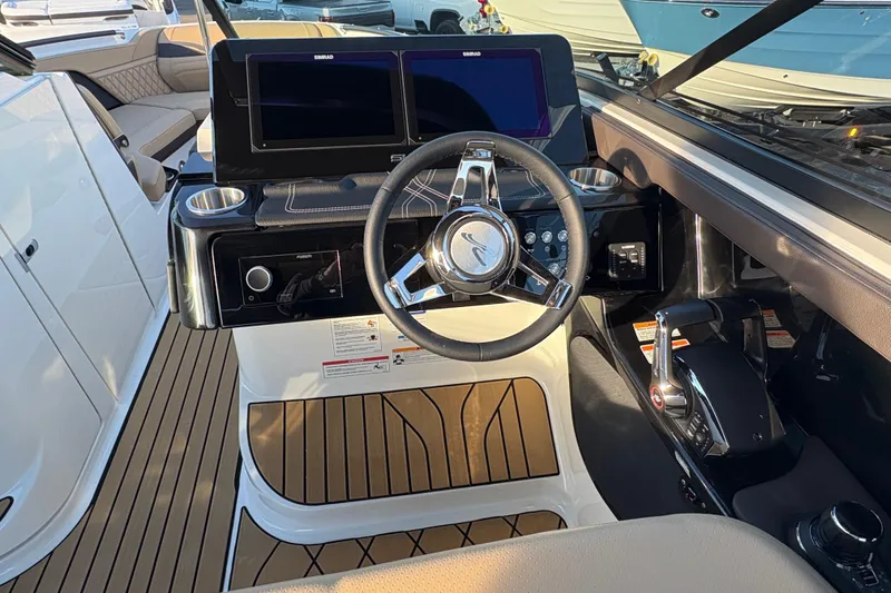 Slide: The Image of 2026 Sea Ray SLX 280 Outboard helm with modern controls and dual displays. - 6