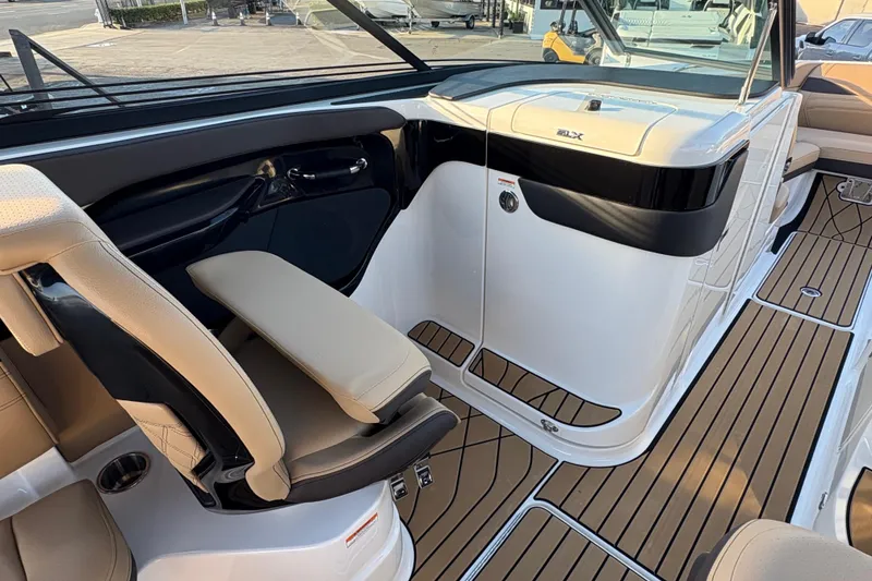 Slide: The Image of 2026 Sea Ray SLX 280 Outboard interior with luxurious seating and sleek design. - 7