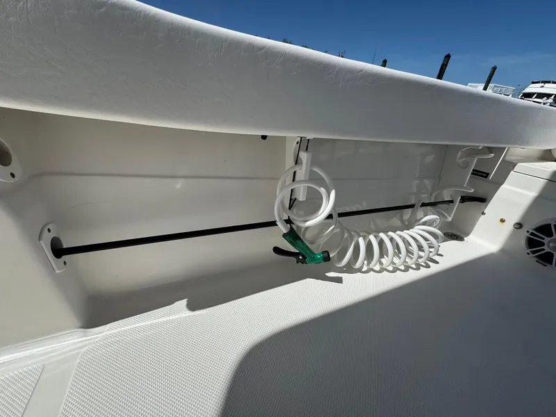 Slide: The Image of 2011 Sea Fox 226 Commander boat interior with coiled hose and storage compartment. - 15