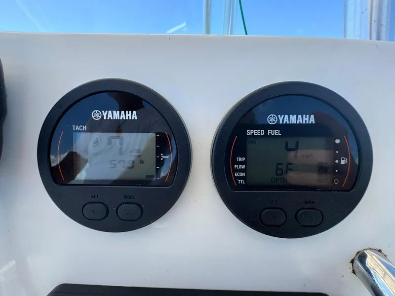 Slide: The Image of Yamaha gauges on a 2011 Sea Fox 226 Commander boat dashboard. - 20