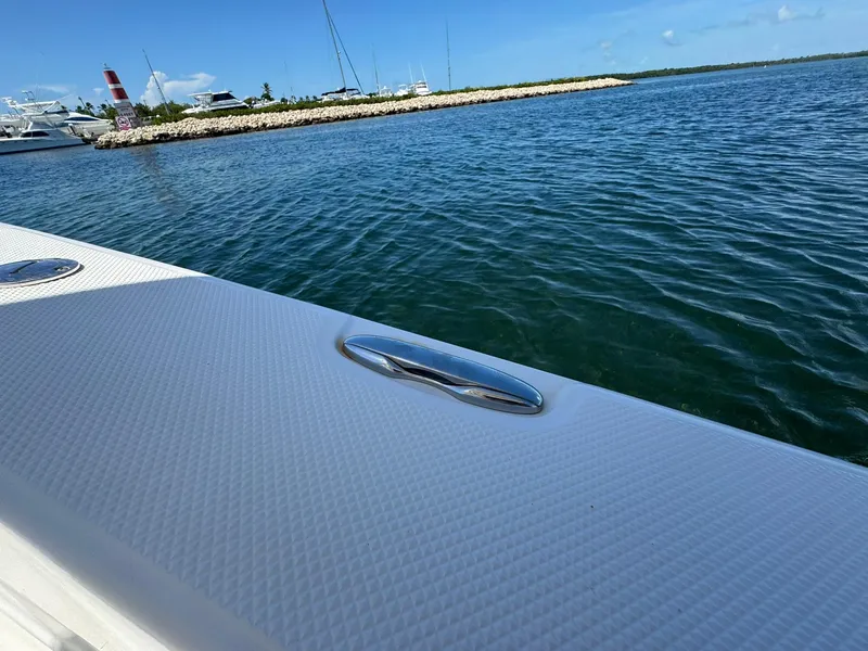 Slide: The Image of Sea Fox 226 Commander boat on calm water near marina, 2011 model. - 24