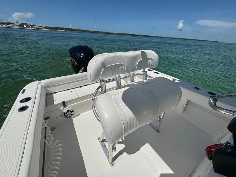 Slide: The Image of 2011 Sea Fox 226 Commander boat interior with seating, on calm water. - 4