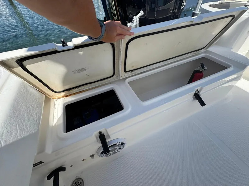 Slide: The Image of Open storage compartment on a 2011 Sea Fox 226 Commander boat. - 7