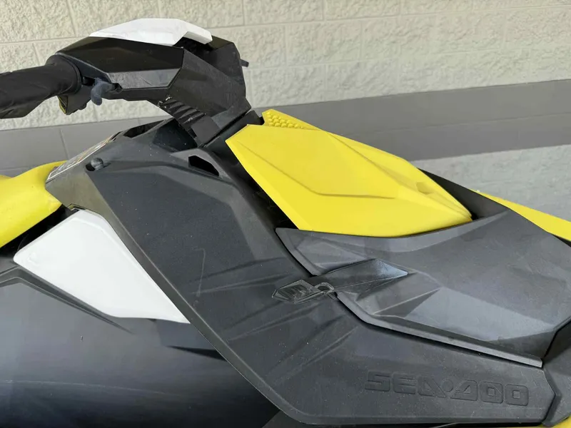Slide: The Image of 2016 Sea-Doo Spark 2up jet ski, yellow and black, close-up view. - 4