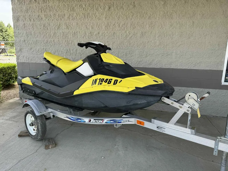 Slide: The Image of 2016 Sea-Doo Spark 2up jet ski in yellow on a trailer. - 9