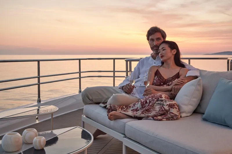 Slide: The Image of Couple relaxing on Prestige M8 yacht at sunset, 2026 model. - 16
