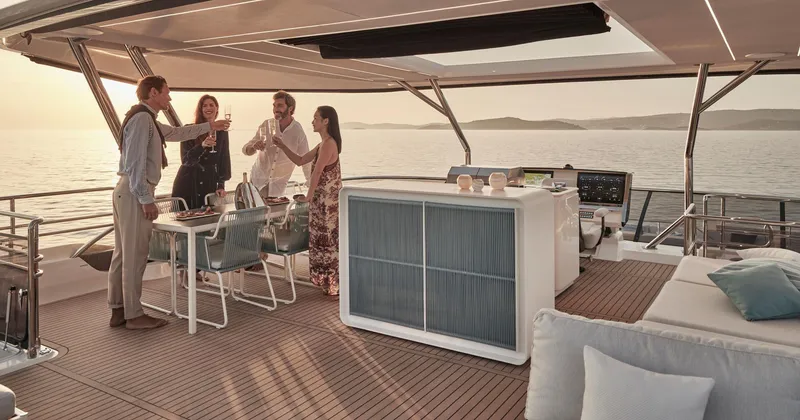 Slide: The Image of Luxury yacht gathering on Prestige M8, 2026 model, with people enjoying drinks at sunset. - 17
