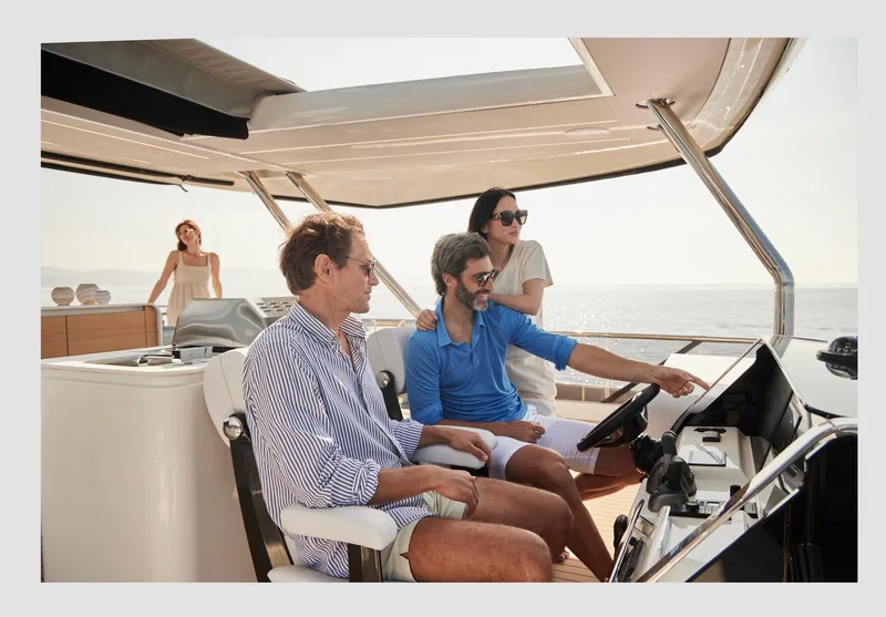 Slide: The Image of People enjoying a cruise on a 2026 Prestige M8 yacht. - 18