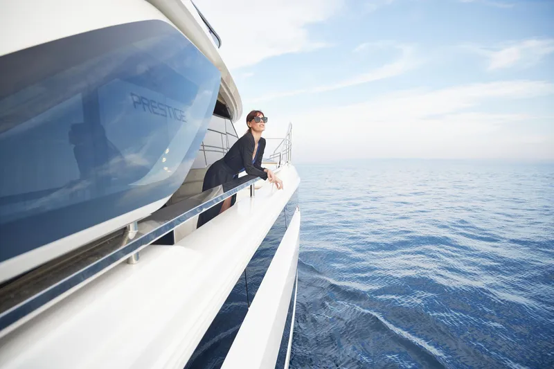 Slide: The Image of Woman enjoying ocean view on Prestige M8 yacht, 2026 model. - 19