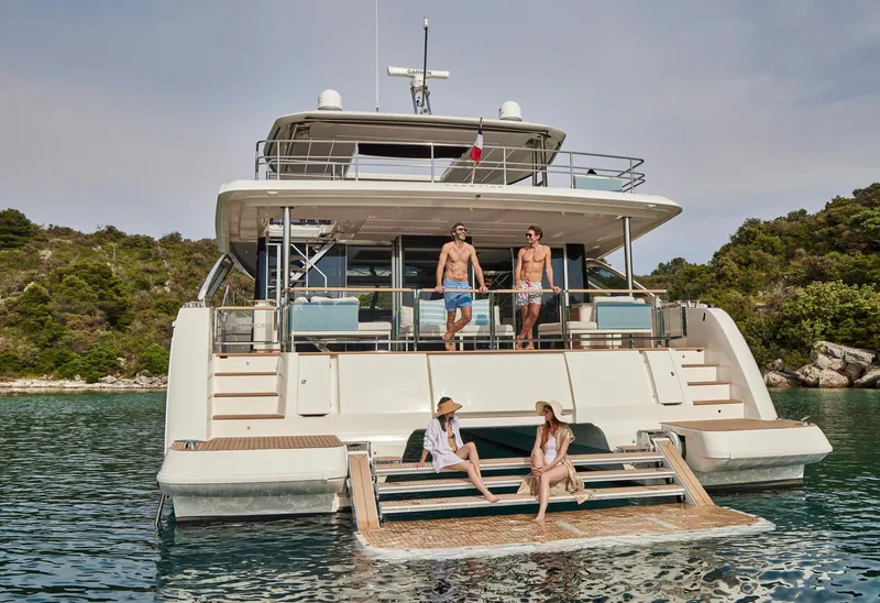 Slide: The Image of Luxury Prestige M8 yacht, 2026 model, with people enjoying the sun on deck. - 2