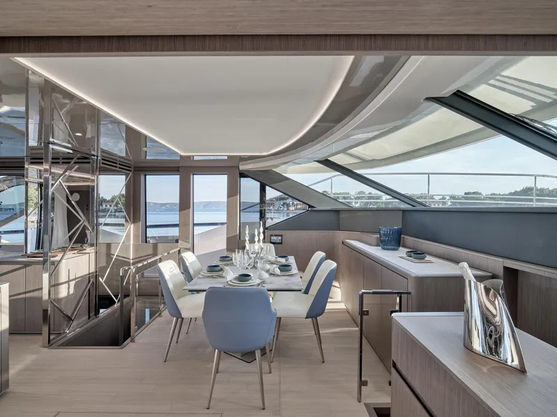 Slide: The Image of Luxurious dining area on 2026 Prestige M8 yacht with elegant table setting and panoramic views. - 22