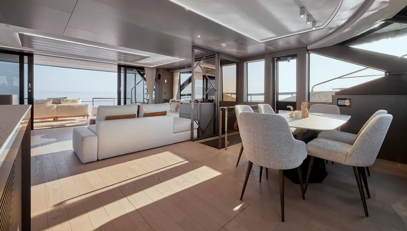 Slide: The Image of Luxurious interior of 2026 Prestige M8 yacht with modern dining and seating areas. - 25