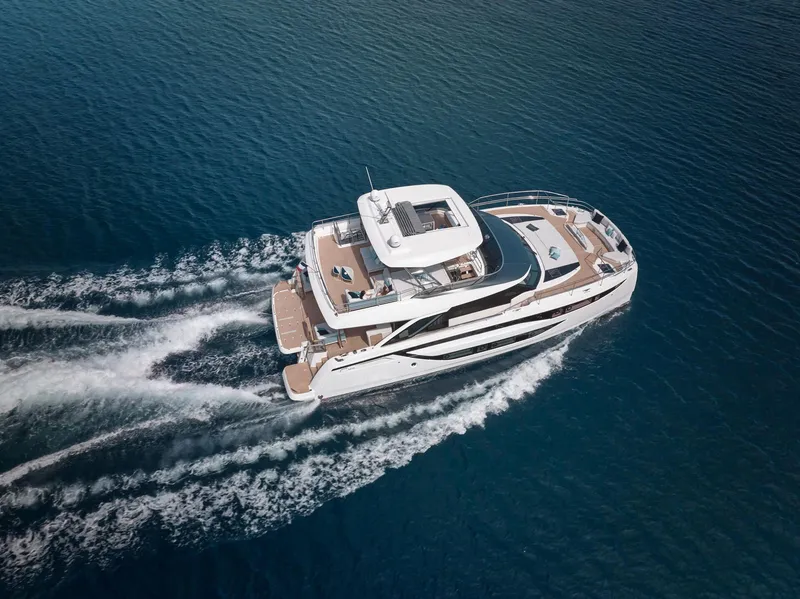 Slide: The Image of Luxurious 2026 Prestige M8 yacht cruising on open water, aerial view. - 39