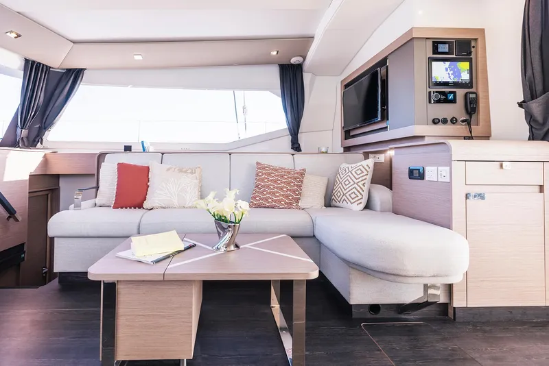 Slide: The Image of Modern interior of 2025 Fountaine Pajot Aura 51 yacht with cozy seating area. - 10