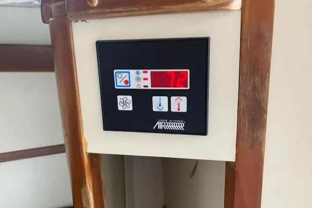 Slide: The Image of Digital control panel on 2001 Legacy Boat 28 Express, displaying temperature settings. - 21