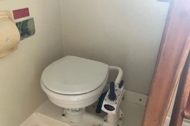 Slide: The Image of Boat bathroom with manual toilet, Legacy Boat 28 Express, 2001 model. - 23