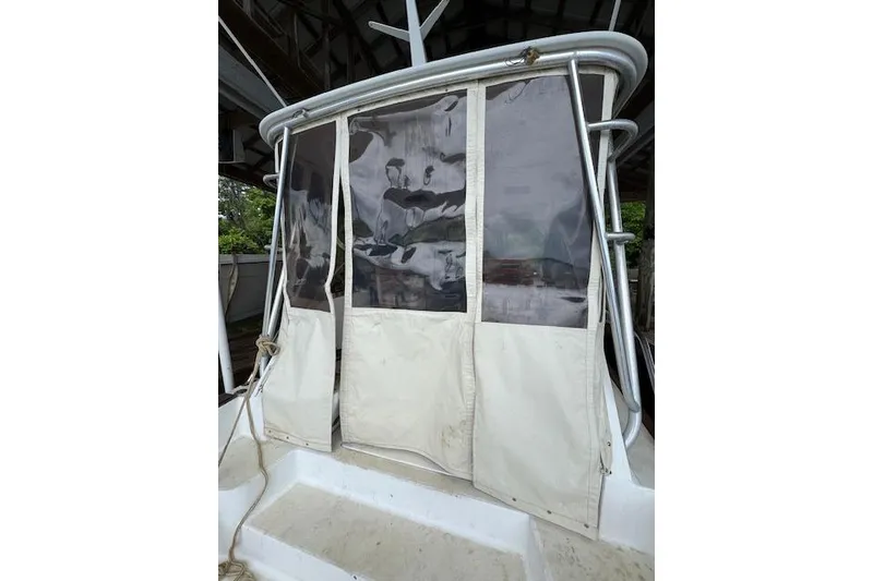 Slide: The Image of 2001 Legacy Boat 28 Express with protective canvas enclosure on deck. - 24