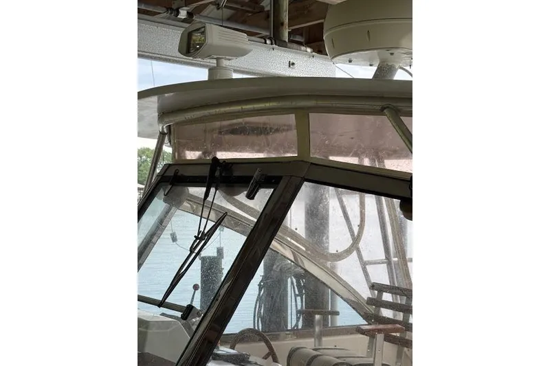 Slide: The Image of 2001 Legacy Boat 28 Express cockpit with windshield and radar equipment. - 26