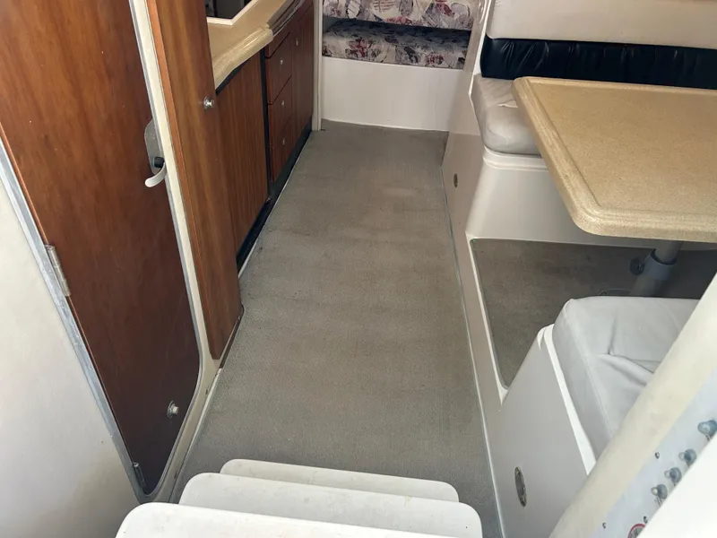 Slide: The Image of Interior of 1999 Wellcraft 330 Coastal boat with seating and cabinetry. - 31