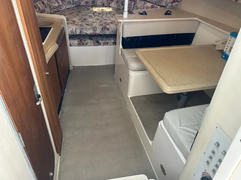 Slide: The Image of Interior of 1999 Wellcraft 330 Coastal boat with dining area and sleeping quarters. - 41