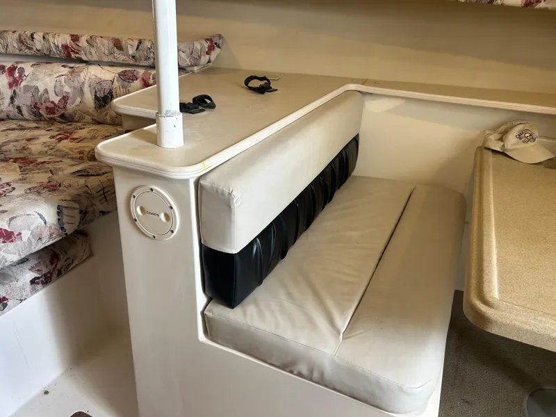 Slide: The Image of Interior seating of 1999 Wellcraft 330 Coastal boat with floral upholstery. - 46