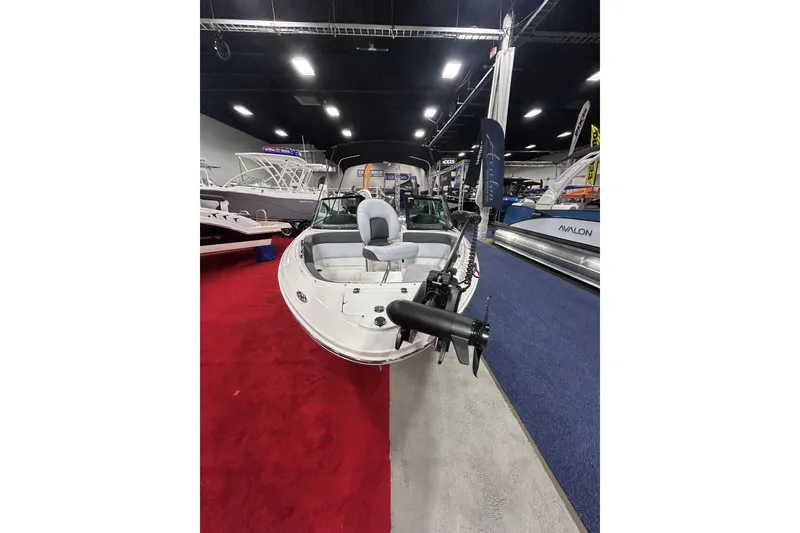 Slide: The Image of 2026 Chaparral 21 SSi Ski & Fish OB boat displayed at an indoor exhibition. - 3
