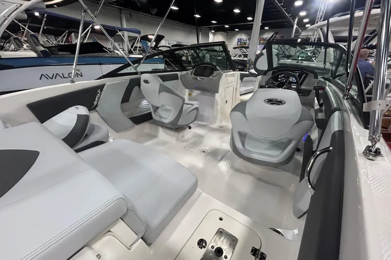 Slide: The Image of 2026 Chaparral 21 SSi Ski & Fish OB boat interior with modern seating and dashboard. - 7