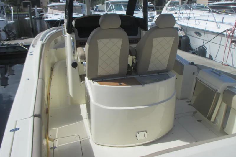 Slide: The Image of 2019 Chris-Craft Catalina 30 boat interior with dual seats and helm station. - 11