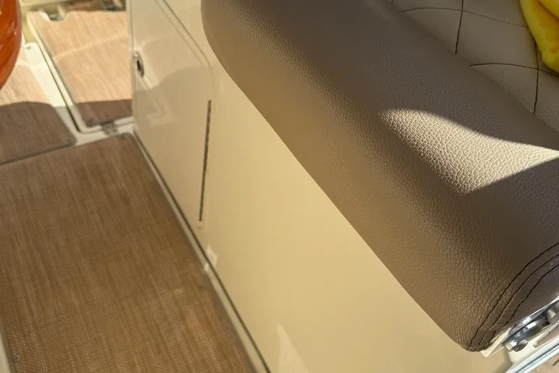 Slide: The Image of 2019 Chris-Craft Catalina 30 interior with beige upholstery and flooring detail. - 15