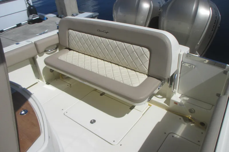 Slide: The Image of 2019 Chris-Craft Catalina 30 boat with elegant beige seating and dual outboard engines. - 17