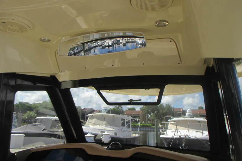 Slide: The Image of Interior view of 2019 Chris-Craft Catalina 30 boat with marina in background. - 21