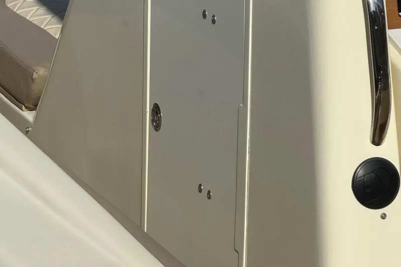 Slide: The Image of 2019 Chris-Craft Catalina 30 boat interior with beige seating and sleek design. - 32