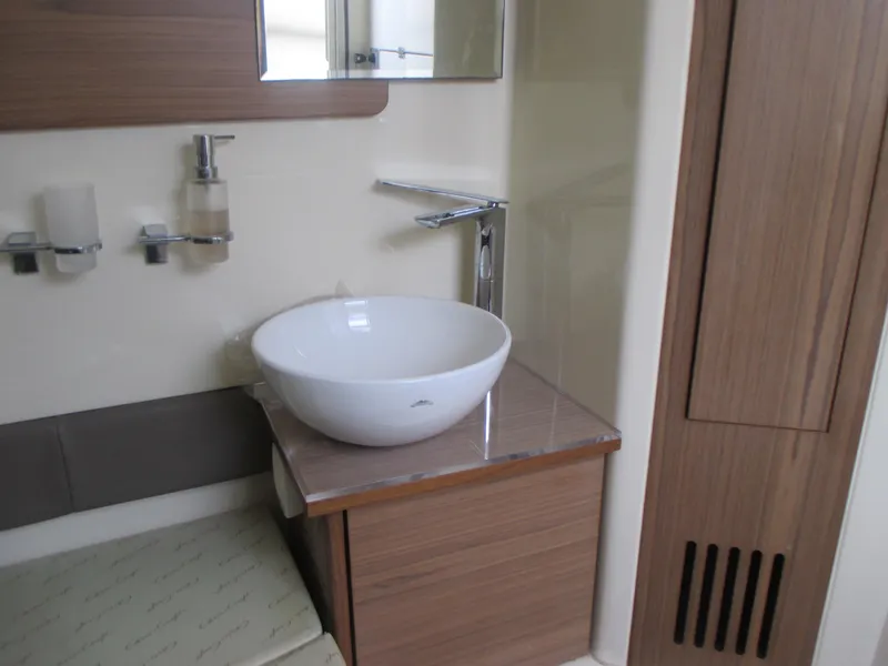 Slide: The Image of Modern bathroom interior of 2019 Chris-Craft Catalina 30 boat with vessel sink. - 35
