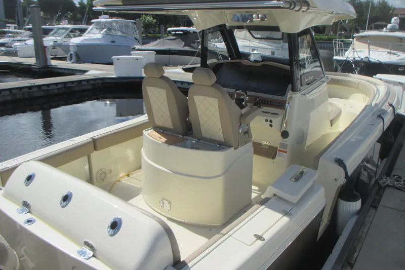 Slide: The Image of 2019 Chris-Craft Catalina 30 boat docked, featuring dual seats and sleek design. - 4