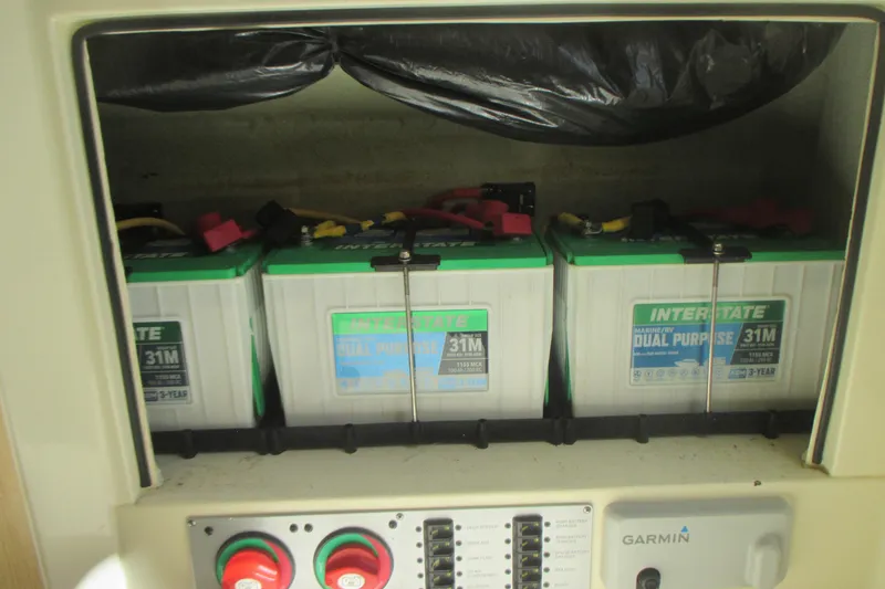 Slide: The Image of Three Interstate marine batteries in a 2019 Chris-Craft Catalina 30 boat compartment. - 41