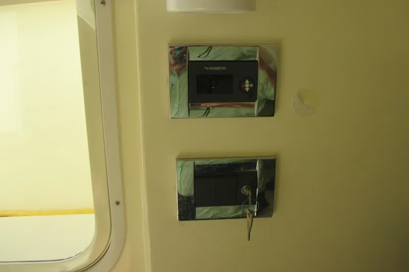 Slide: The Image of Control panel inside 2019 Chris-Craft Catalina 30 boat, featuring Dometic system. - 42