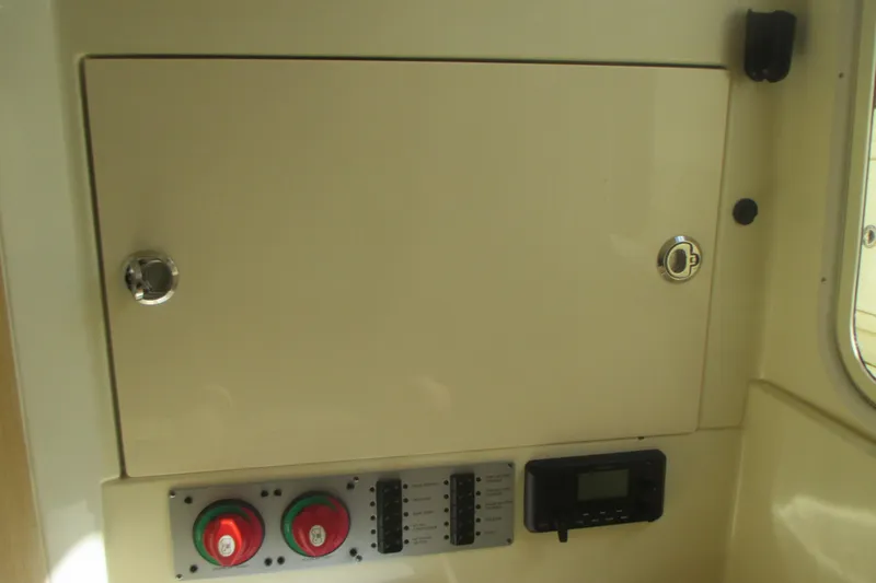 Slide: The Image of Control panel of 2019 Chris-Craft Catalina 30 boat, featuring switches and dials. - 44