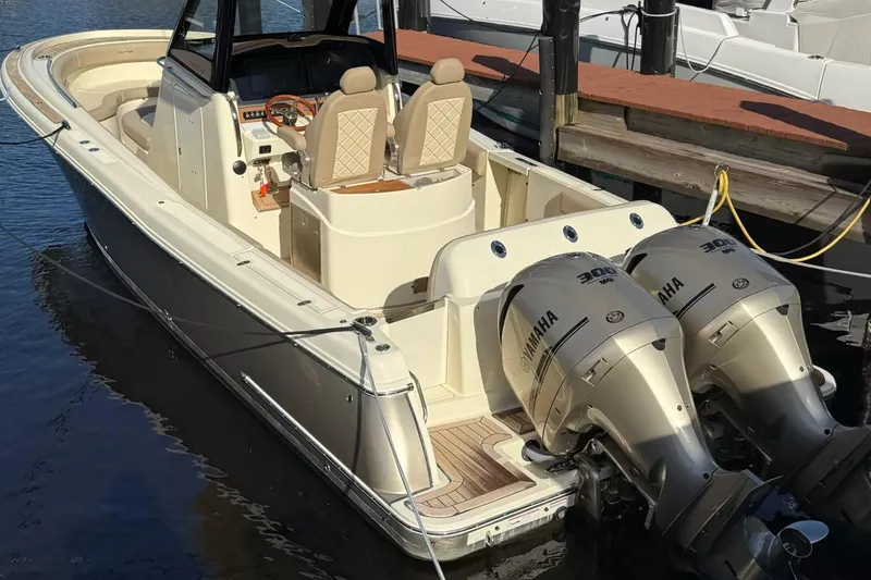 Slide: The Image of 2019 Chris-Craft Catalina 30 boat with dual Yamaha engines docked in marina. - 5