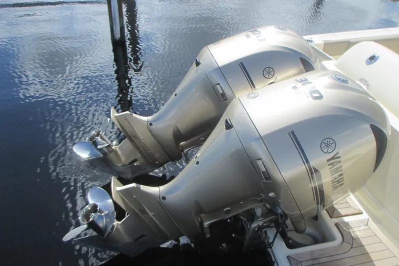 Slide: The Image of Twin Yamaha outboard engines on a 2019 Chris-Craft Catalina 30 boat, docked on water. - 7
