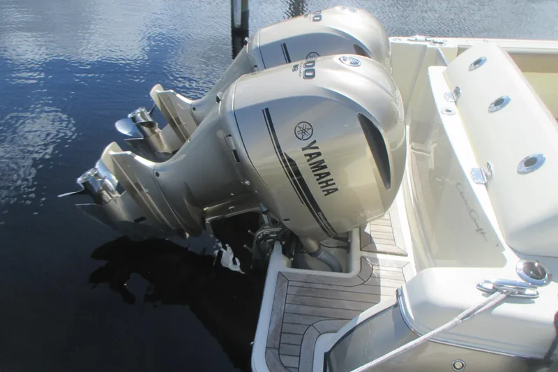 Slide: The Image of 2019 Chris-Craft Catalina 30 with twin Yamaha outboard engines on calm water. - 8