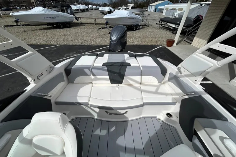 Slide: The Image of 2026 Chaparral 21 SSi OB boat interior with white seating and modern design. - 10