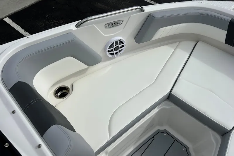 Slide: The Image of 2026 Chaparral 21 SSi OB boat interior with white and gray seating. - 13
