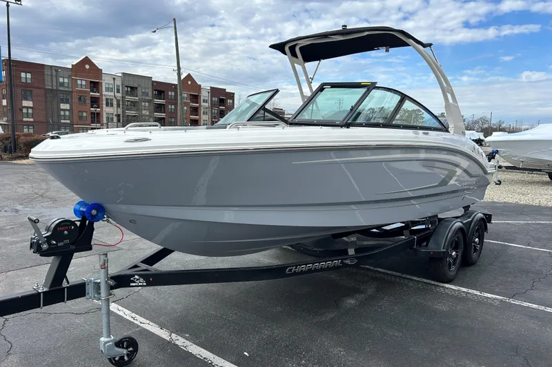 Slide: The Image of 2026 Chaparral 21 SSi OB boat on trailer in urban setting. - 3