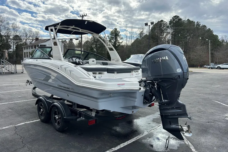 Slide: The Image of 2026 Chaparral 21 SSi OB boat with Yamaha outboard motor in a parking lot. - 4