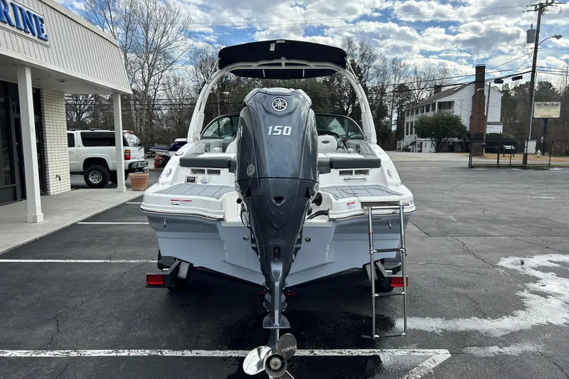 Slide: The Image of 2026 Chaparral 21 SSi OB boat with Yamaha 150 outboard motor in parking lot. - 5