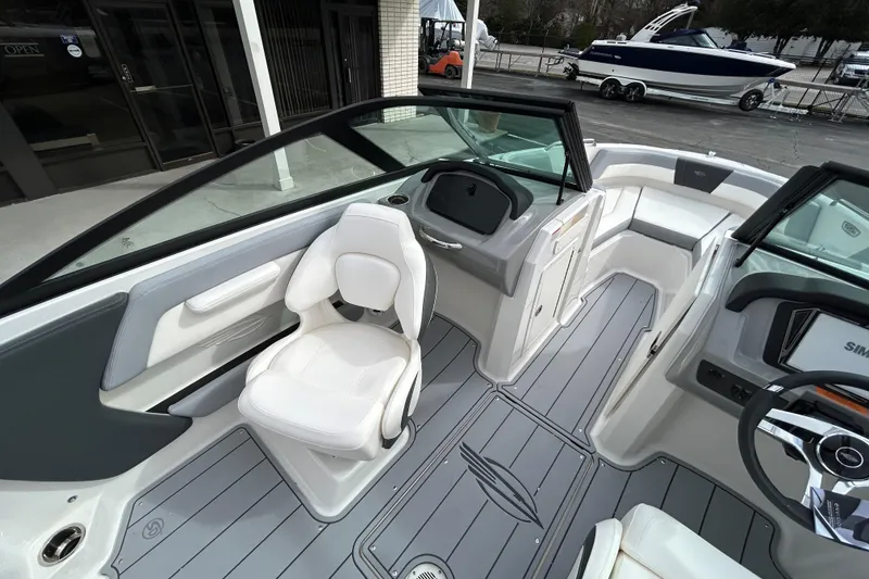 Slide: The Image of 2026 Chaparral 21 SSi OB boat interior with modern seating and sleek design. - 8