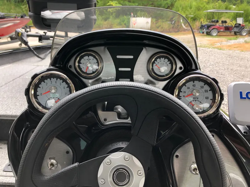 Slide: The Image of Dashboard of 2021 Bass Tracker PRO TEAM 175 TXW boat with gauges and steering wheel. - 10